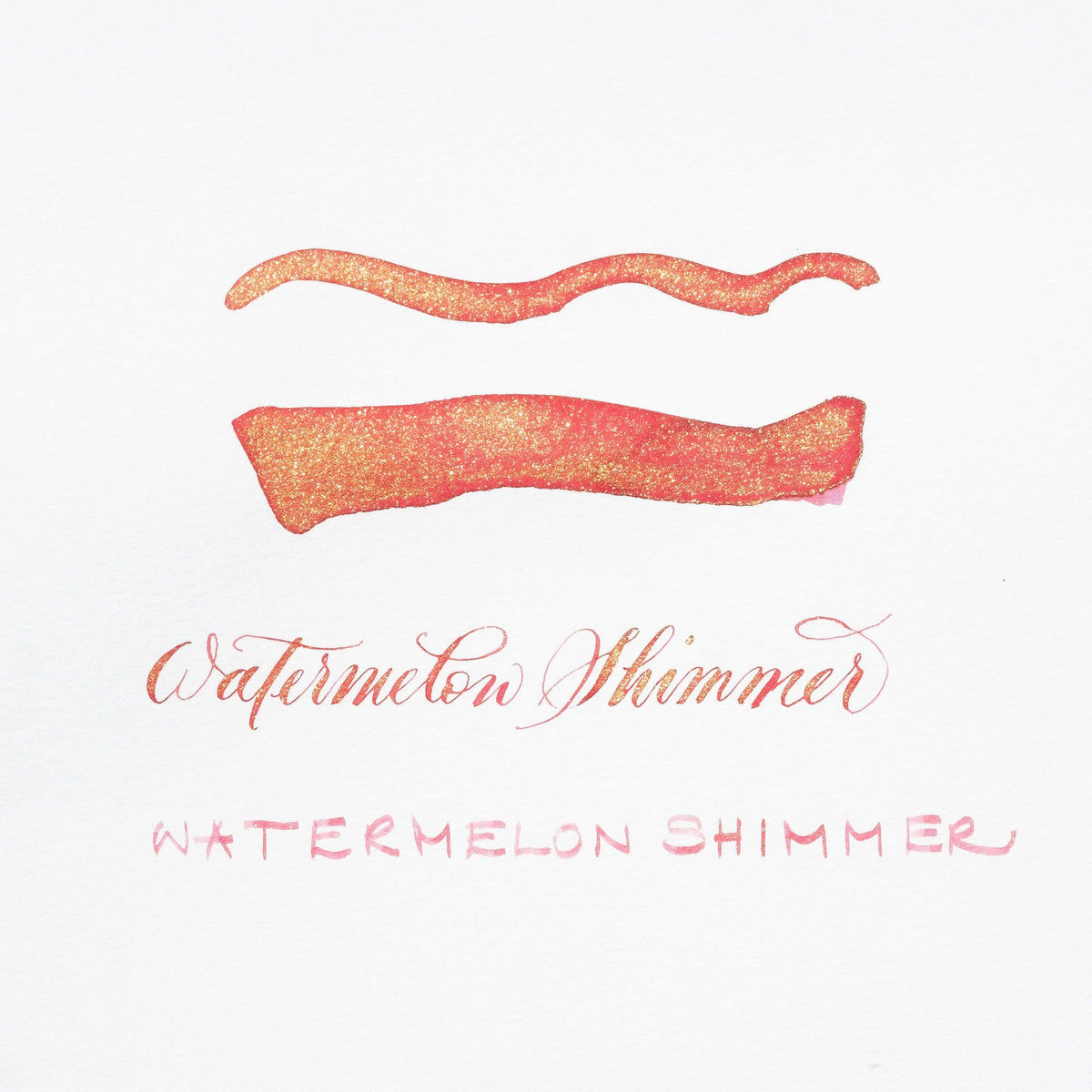 Watermelon shimmer ink swatch with orange-pink glitter lines on white card