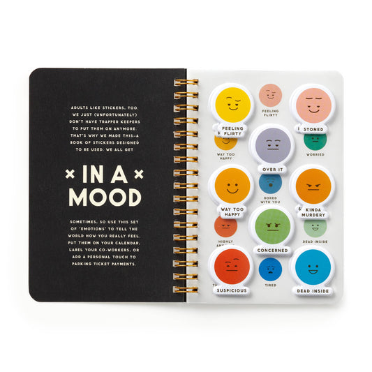 Open mood sticker book with speech-bubble face stickers on right page