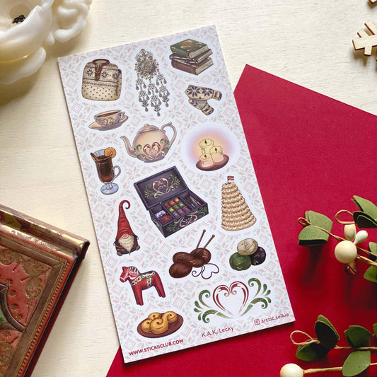 Nordic winter sticker sheet on red card, featuring tea, gnome, and holiday ornaments