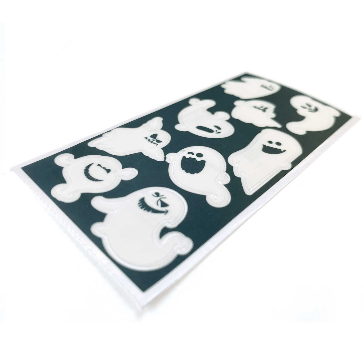 Ghost sticker sheet with white ghost icons on dark green backing