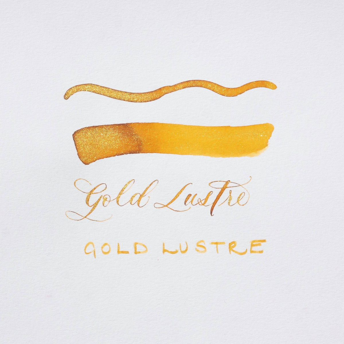 Golden Lustre gold shimmer ink strokes with handwritten Gold Lustre label