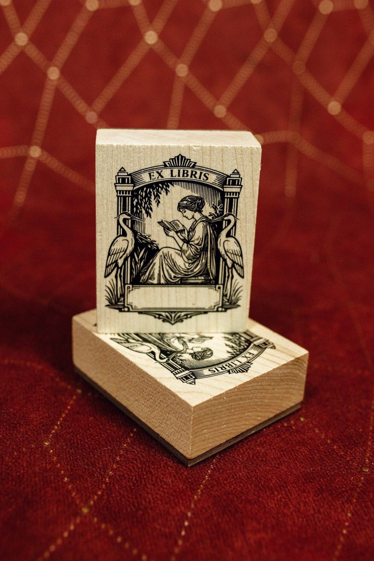 Wooden Ex Libris art deco stamp standing on a base block