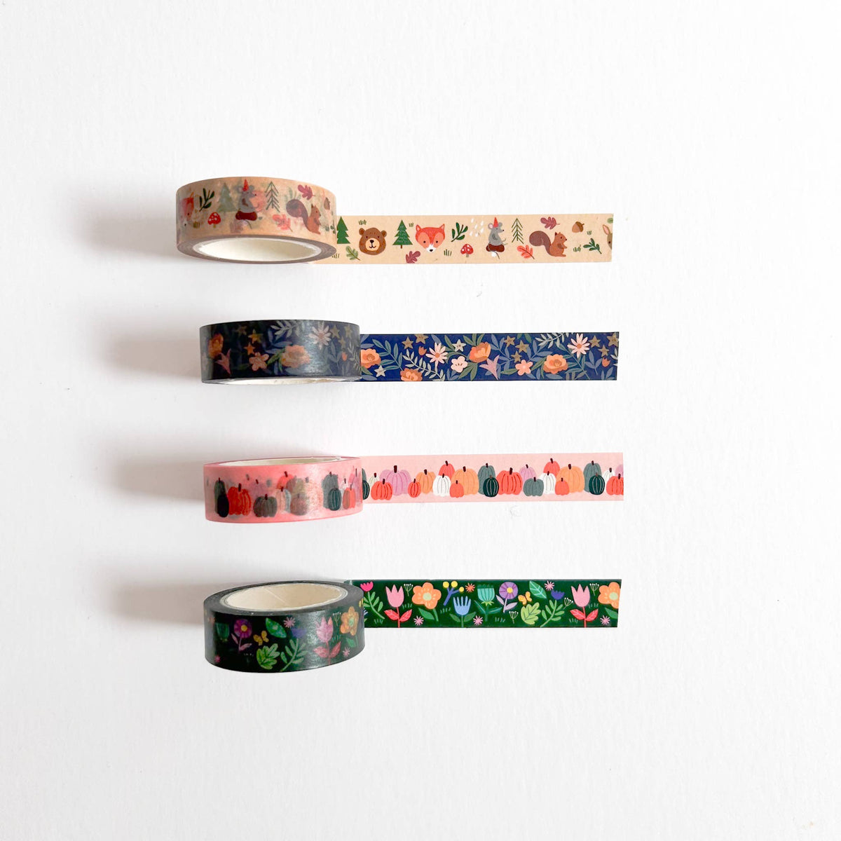 Set of four washi tape rolls with floral, cactus, and forest motifs