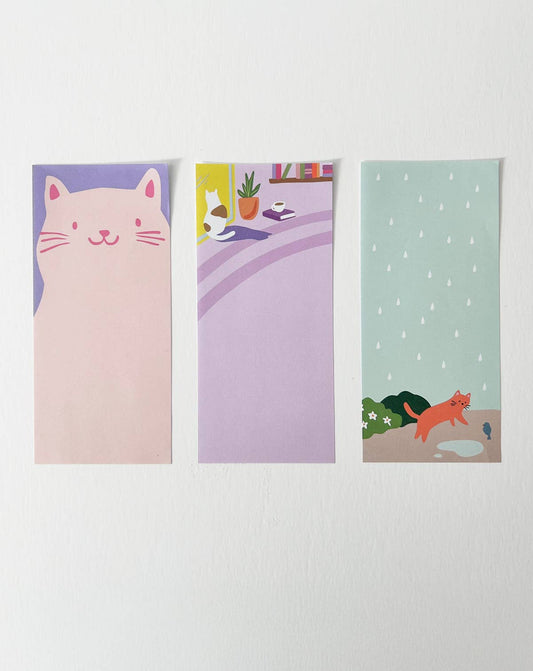 Set of three notepads with cat, room, and fox illustrations on pastel covers