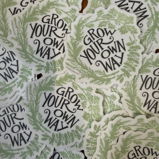 Multiple leaf-themed stickers with 'Grow Your Own Way' text in green on white.