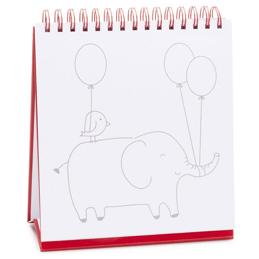 Watercolor pad on red tabletop easel with line drawing elephant and balloons