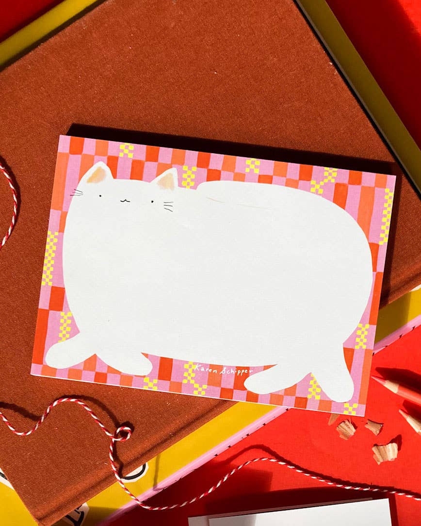 Cat notepad with a large white cat illustration and pink and coral checkered border