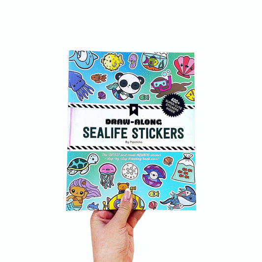 Sea life sticker book held front cover showing sticker designs and “Draw-Along” text