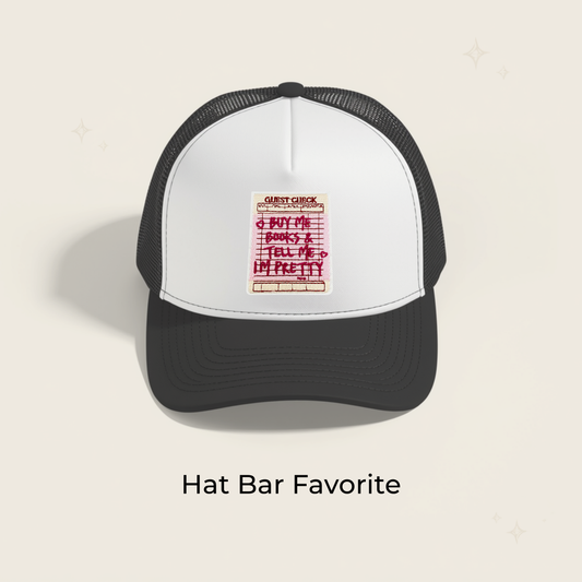Black and white baseball cap with embroidered pink iron-on patch
