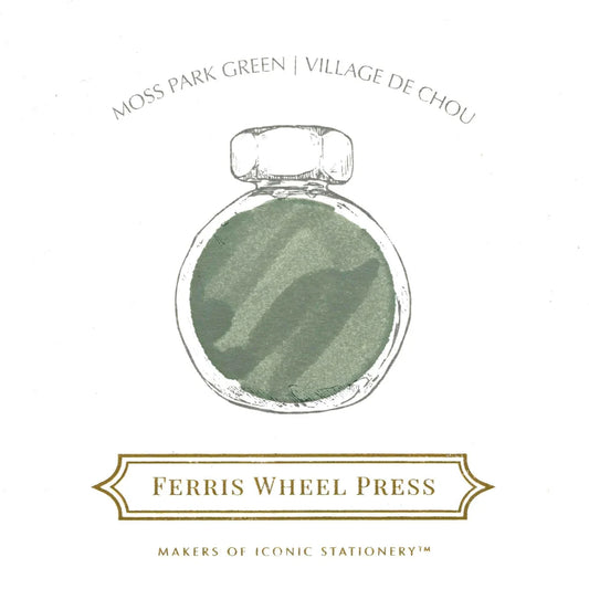 Green ink bottle with embossed label text and cap