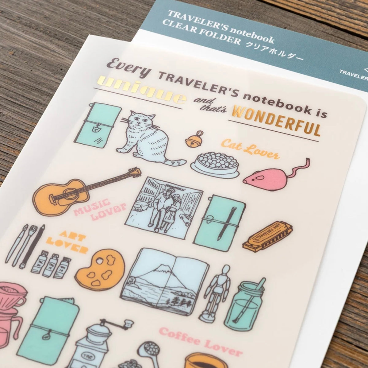 Close-up of the clear folder's colorful notebook-themed illustrations and rounded corner