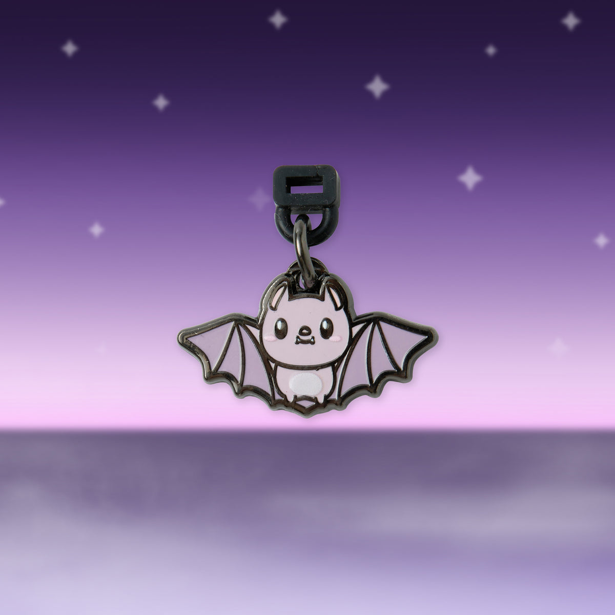 Metal bat keychain charm with panda-like face and clasp
