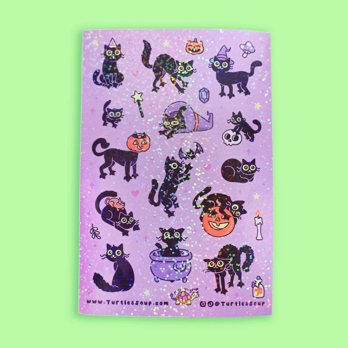 Purple Halloween sticker sheet featuring multiple black cat glitter designs and charms
