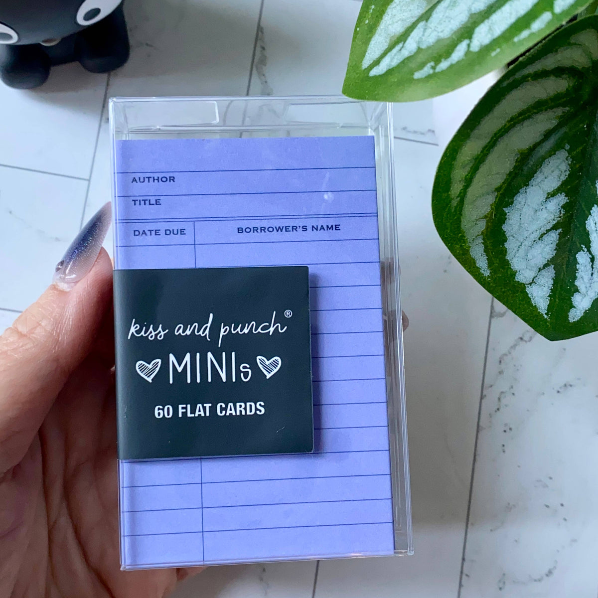 Purple library card mini notecards in a clear case, showing borrower and due-date fields