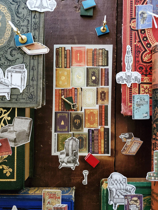 Assorted book and charm stickers with pendants, ornaments, and small card designs