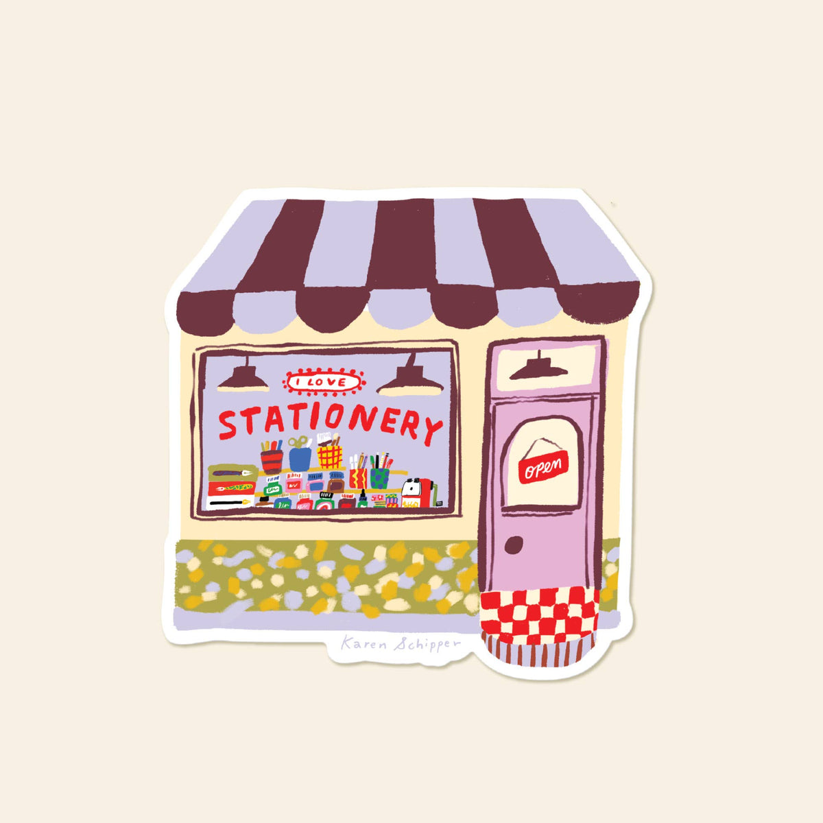 Vinyl stationery shop sticker with a striped awning, colorful supplies, and a pink door