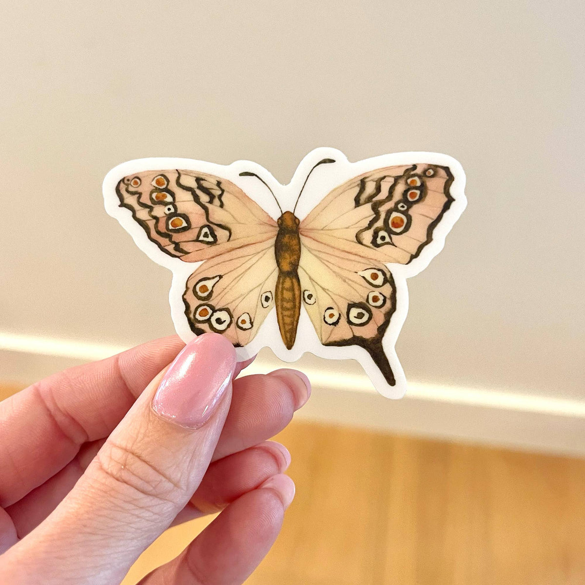 Pink butterfly vinyl sticker, die-cut with detailed wings and orange accents