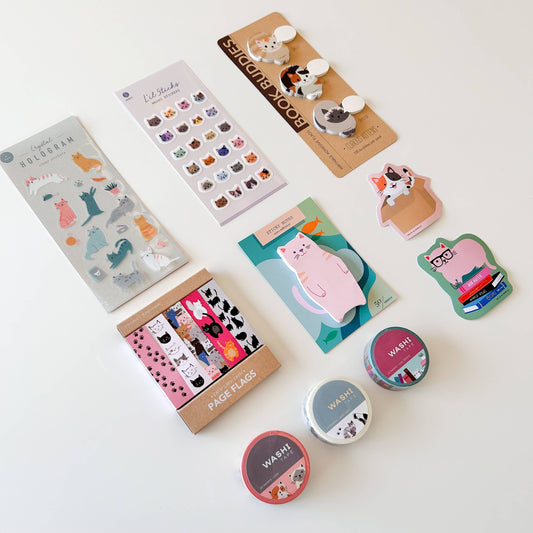 Assorted die-cut sticky notes sheets with animal designs and page flags on display