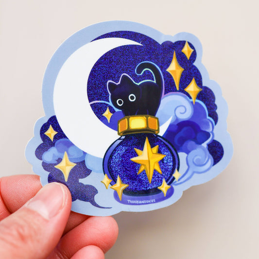 Holographic vinyl sticker with purple wizard cat, gold stars, and crescent moon