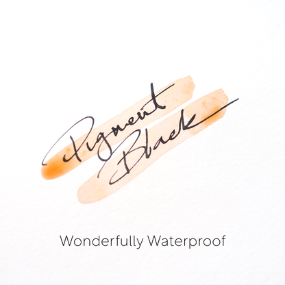 Black pigment fountain pen ink handwriting sample on white paper