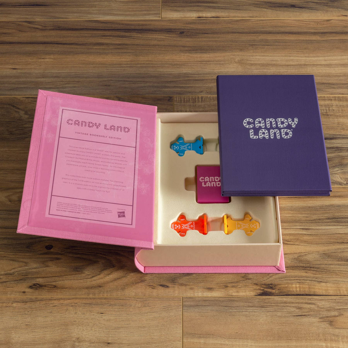 Candy Land bookshelf edition box open, showing booklet and plastic tokens