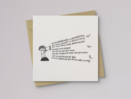 Encouragement card front with letterpress text, girl illustration, and kraft envelope