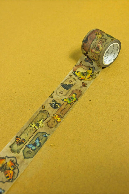 Butterfly washi tape roll with a strip of illustrated butterflies and insects