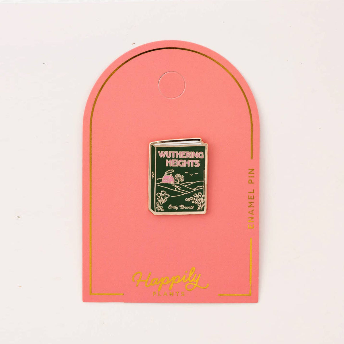 Enamel book pin with 'Wuthering Heights' cover, centered on pink 'Happy' card