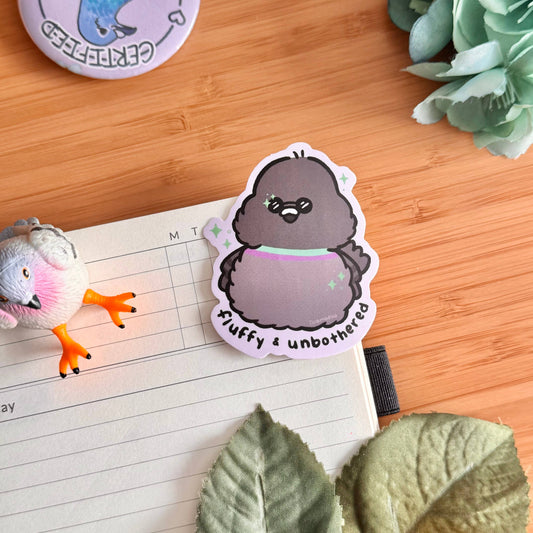 Penguin character sticker with purple scarf and white border