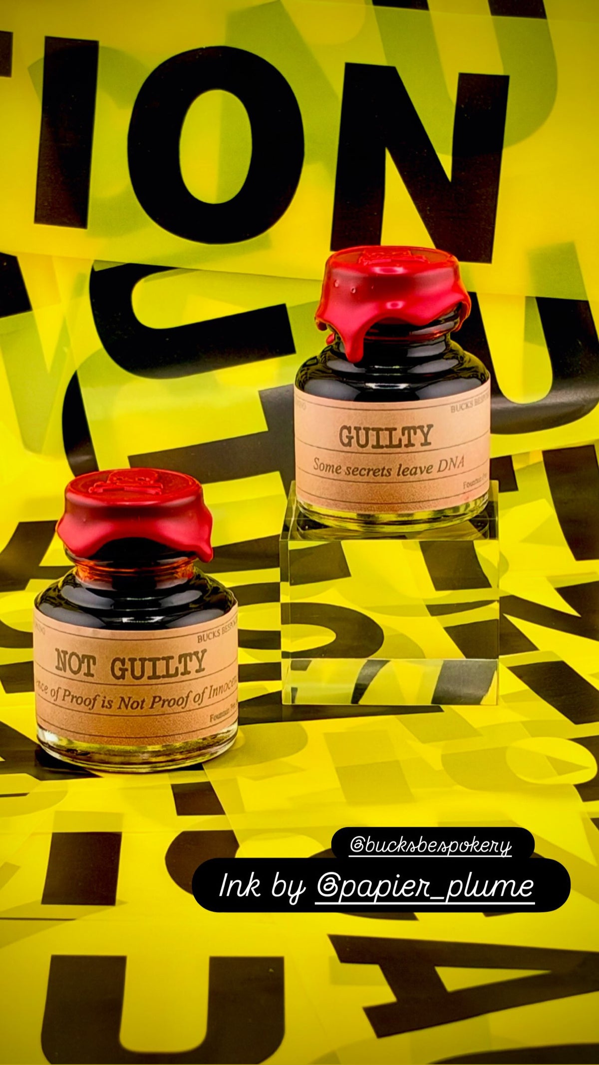 Book of Reckoning set with two glass ink jars and red lids, 'GUILTY' ink visible