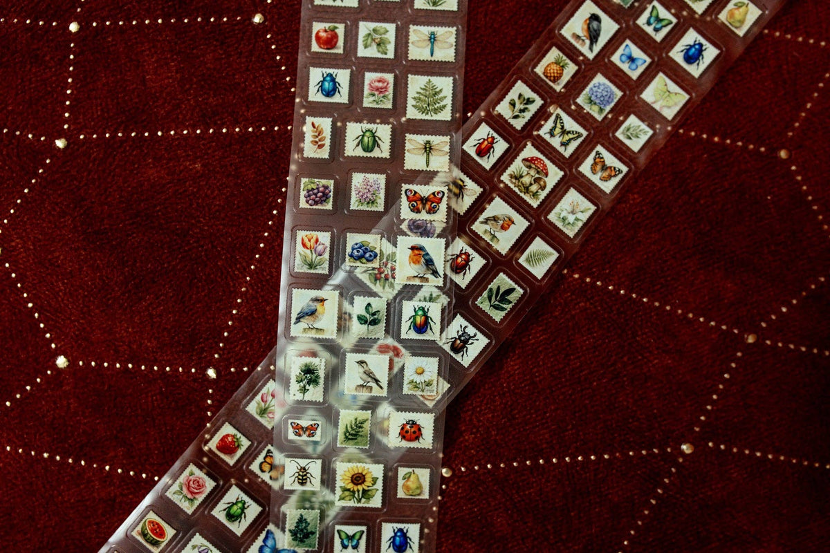 Transparent tape with mini postage stamp prints, long strip with repeating stamp squares
