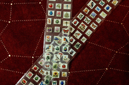 Transparent tape with mini postage stamp prints, long strip with repeating stamp squares