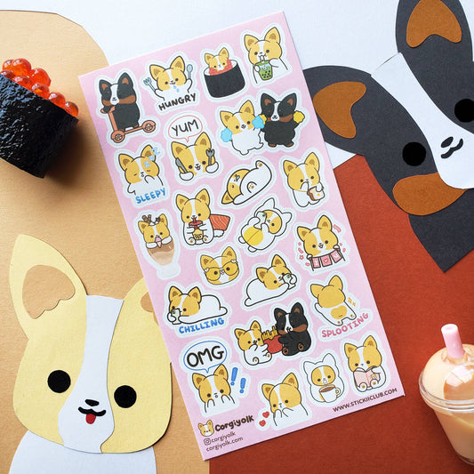 Corgi sticker sheet with colorful cartoon corgis, placed among craft items