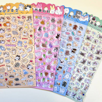 Set of 4 sticker sheets featuring cartoon cats, bunnies, hearts, and small objects in rows.