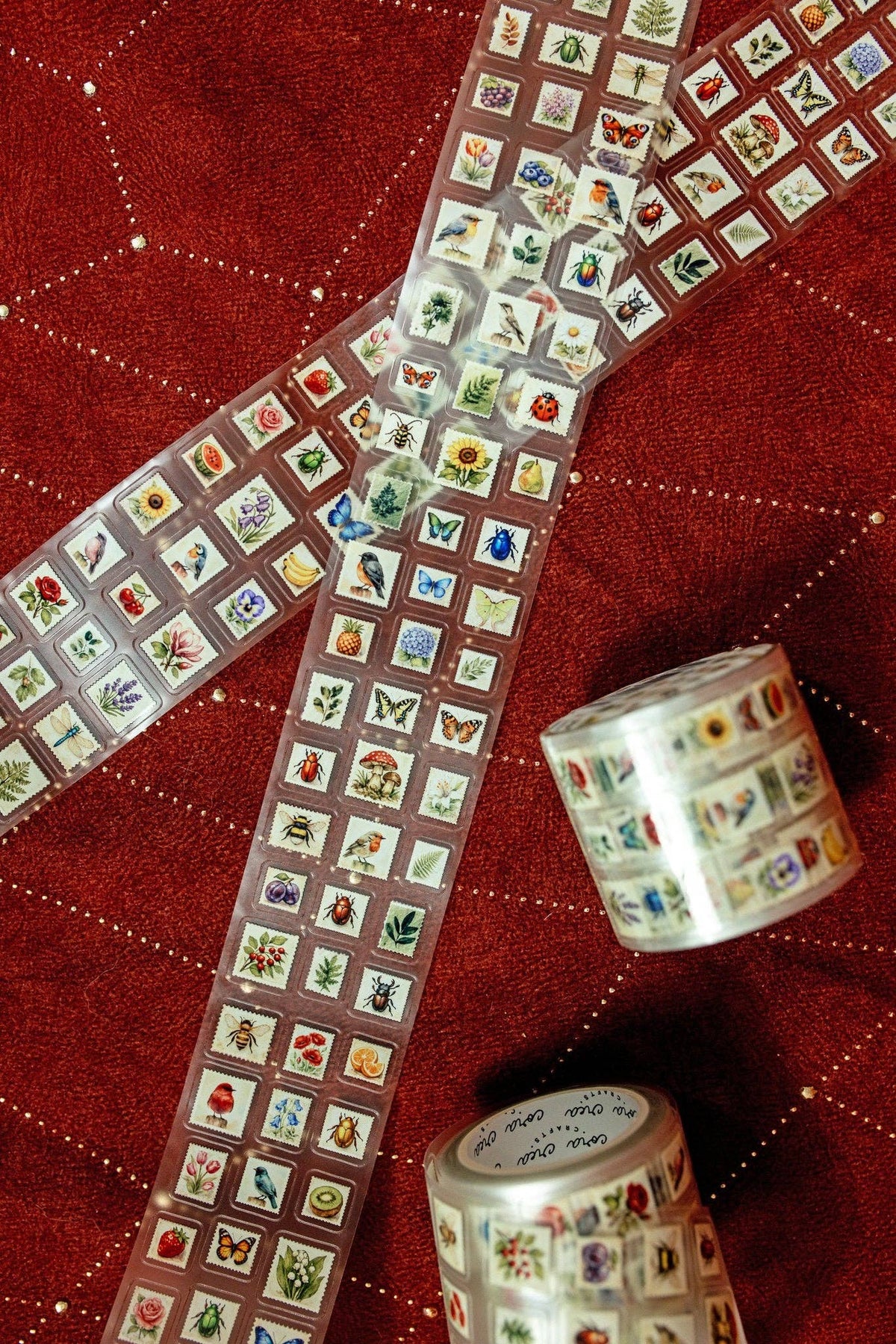 Transparent tape with mini postage stamps, long strip with stamp squares and two rolls