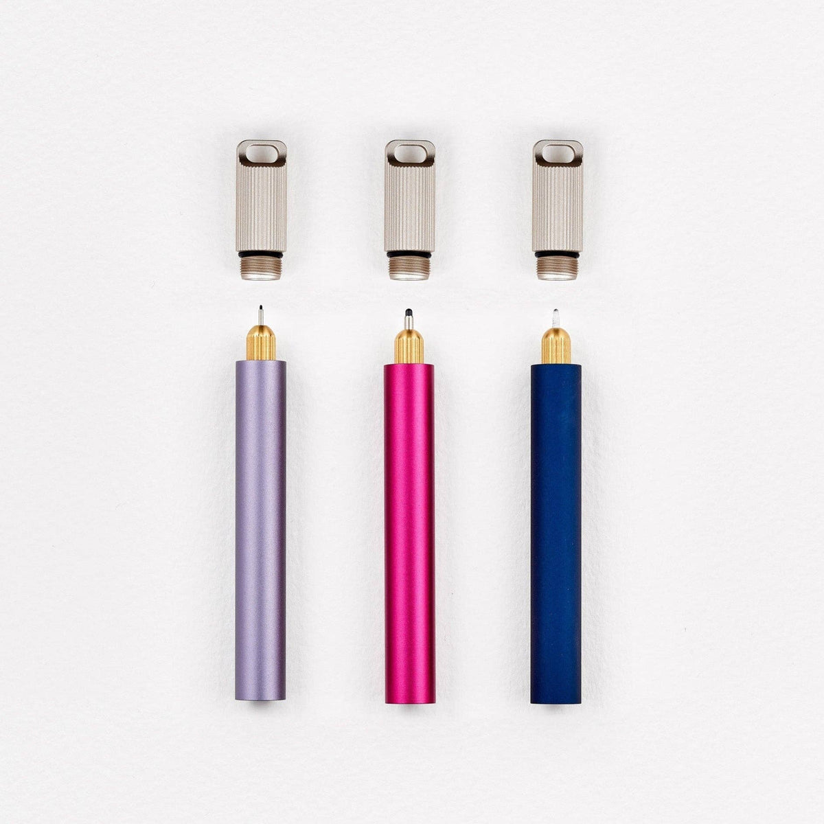 Three keychain pens with metal caps in purple, pink, and blue