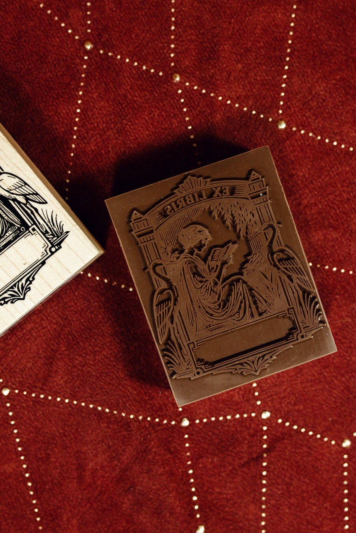 Wooden stamp block with carved Ex Libris art deco figure and border details