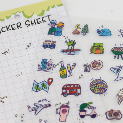 Clear planner sticker sheet close-up with camping, car, and planet icons