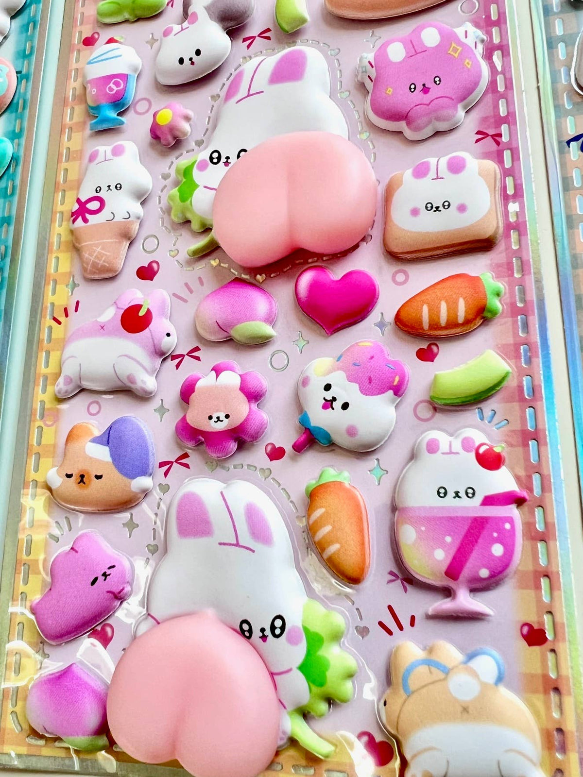 Pink and purple animal squishy butt sticker sheet with heart and fruit-shaped stickers