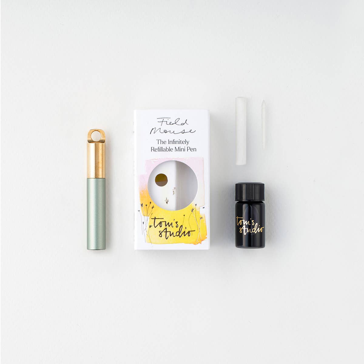 Refillable travel pen set: sage green pen with gold clip, plus refill bottle and box