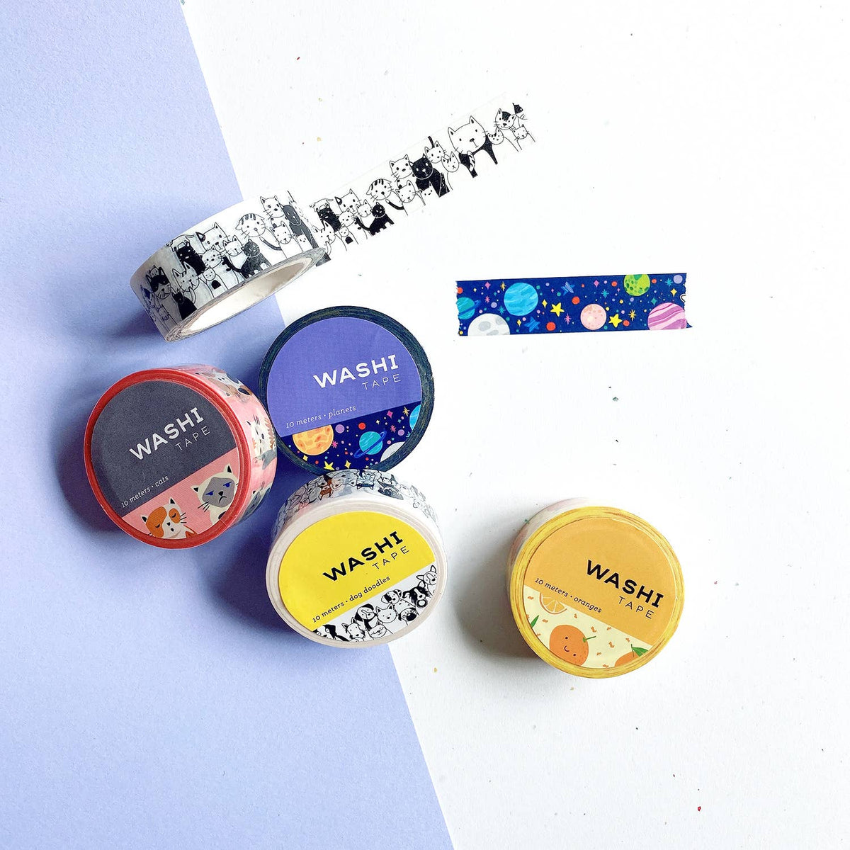 Dog doodles washi tape rolls with starry and animal designs, plus tape strip