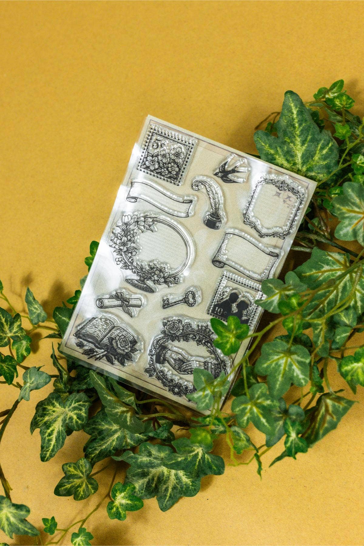Clear stamp sheet with vintage frames, flowers, and swirling ornaments for cards
