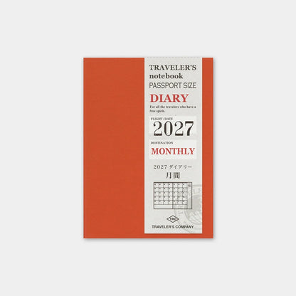 Passport-size 2027 monthly diary notebook with orange cover and calendar layout.