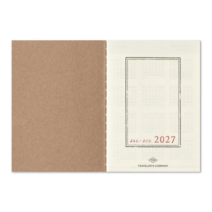 Passport-size diary cover with tan outer and 'JAN–JUN 2027' label