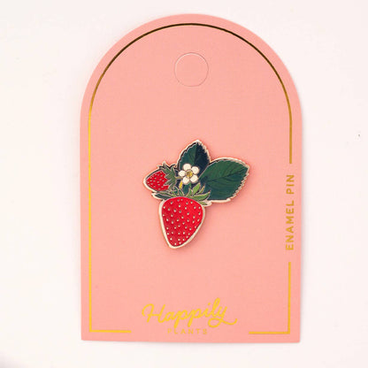 Strawberry blossom enamel pin: red berry with white dots, green leaves, and white flower