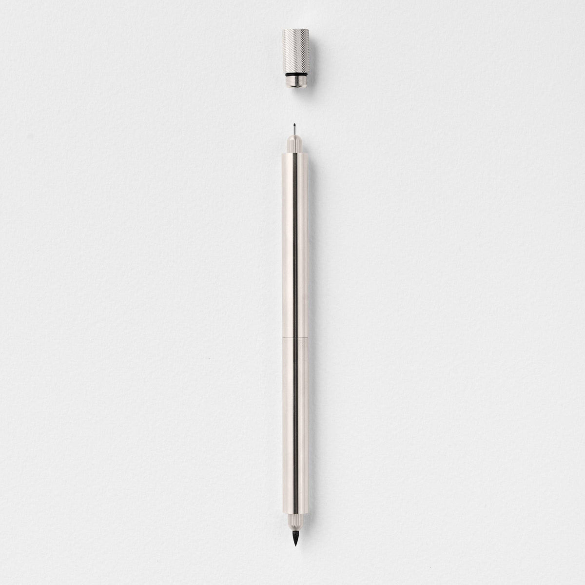 Stainless steel fountain pen with textured grip and single tip