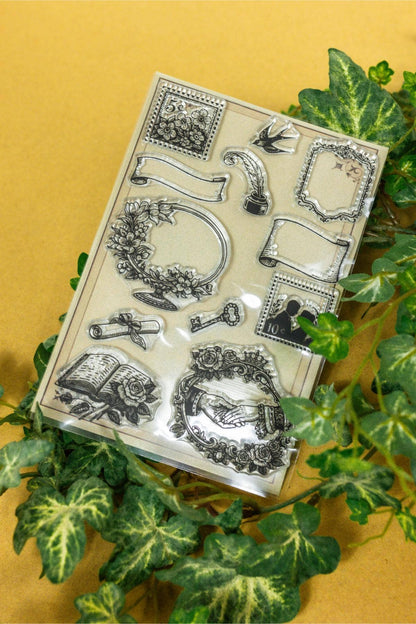 Clear stamp sheet showing ornate scrollwork, borders, and decorative frame shapes