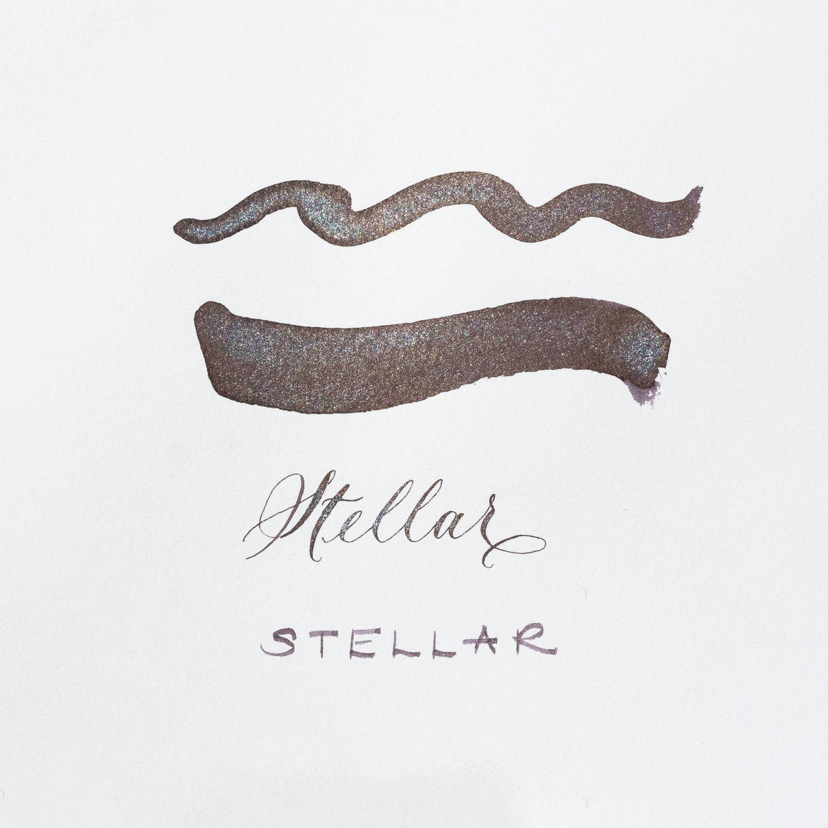 Metallic purple shimmer ink swatches on white card with Stellar label