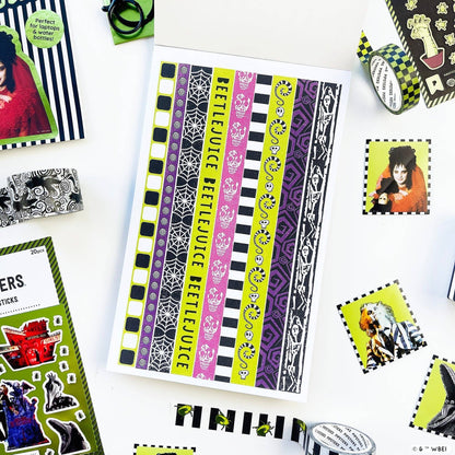Striped sticker sheet featuring vertical purple, yellow, and black bands with icons