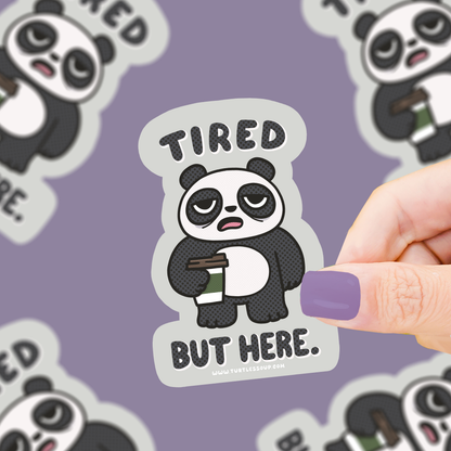 Panda vinyl sticker: 'Tired but here' with sleepy eyes